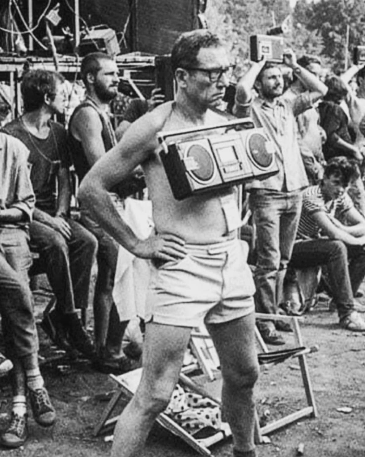 man recording a cassette tape at a music festival in poland 1980s - C